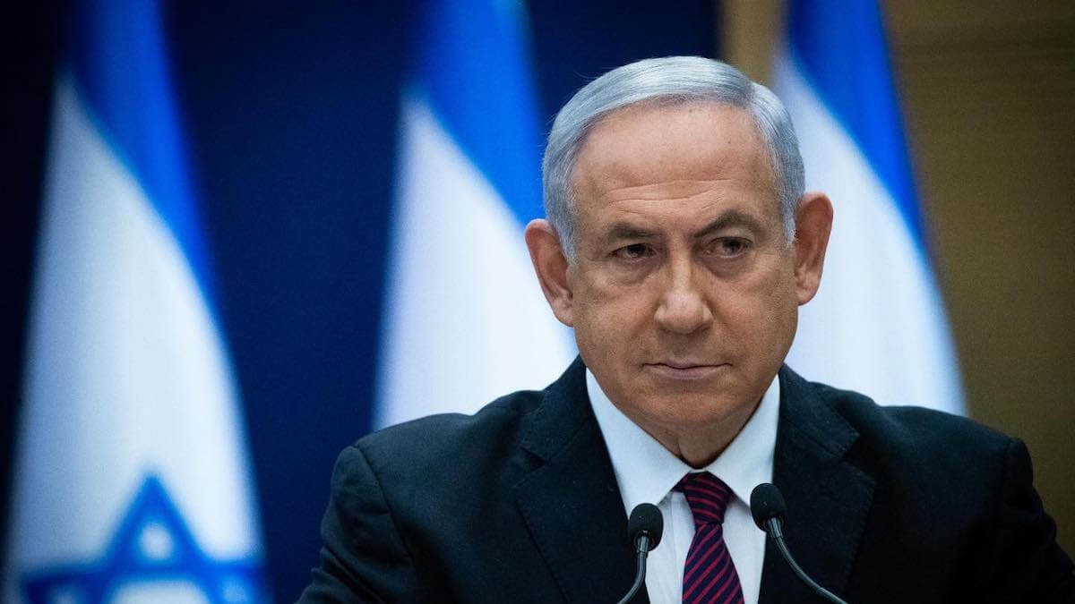 Israeli Prime Minister Benjamin Netanyahu wearing a black coat