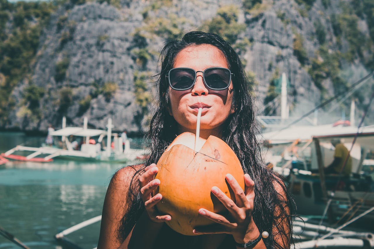 Girl Drinking Coconut